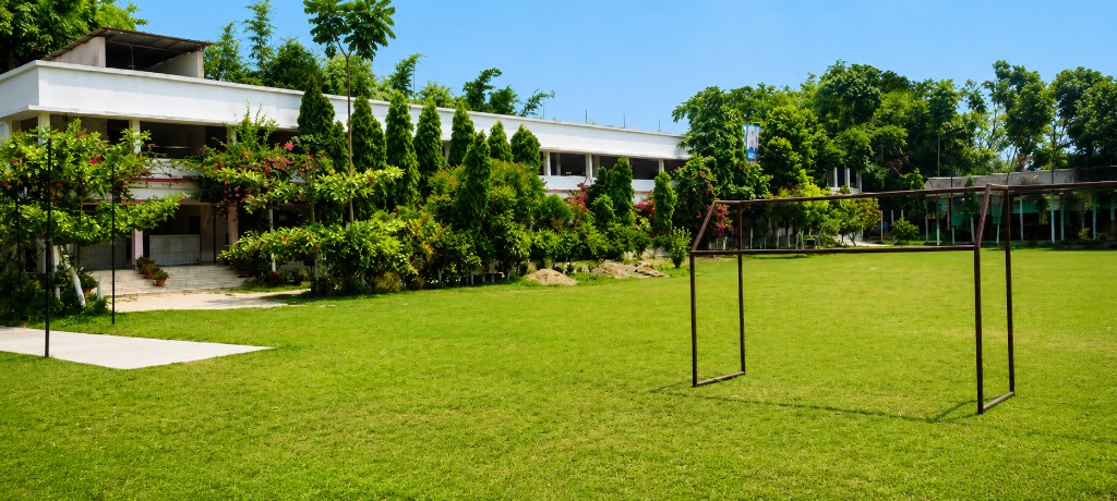 School football field and goalposts at Christ Mission School campus